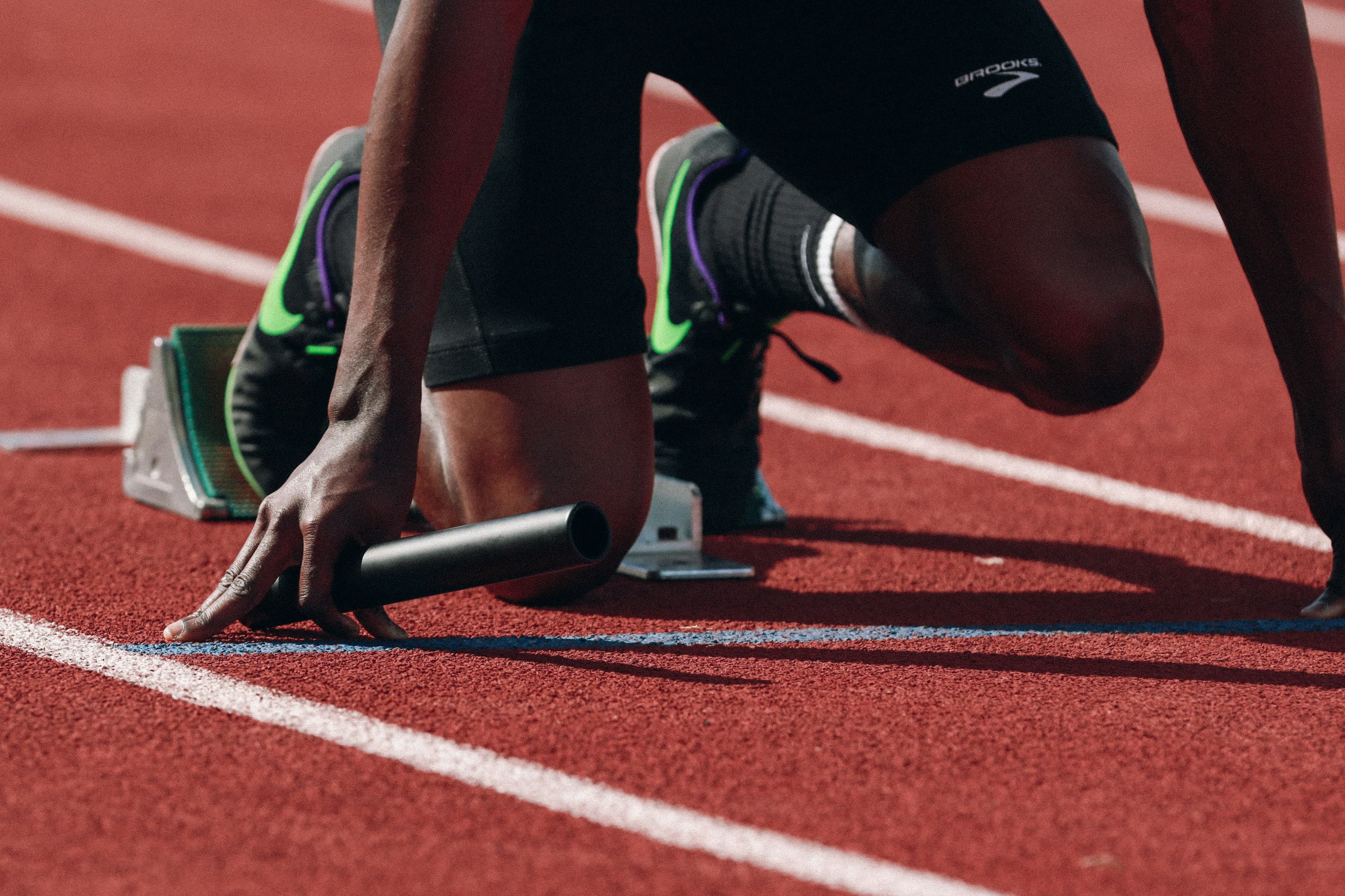 Track sprinter set in the blocks ready to race